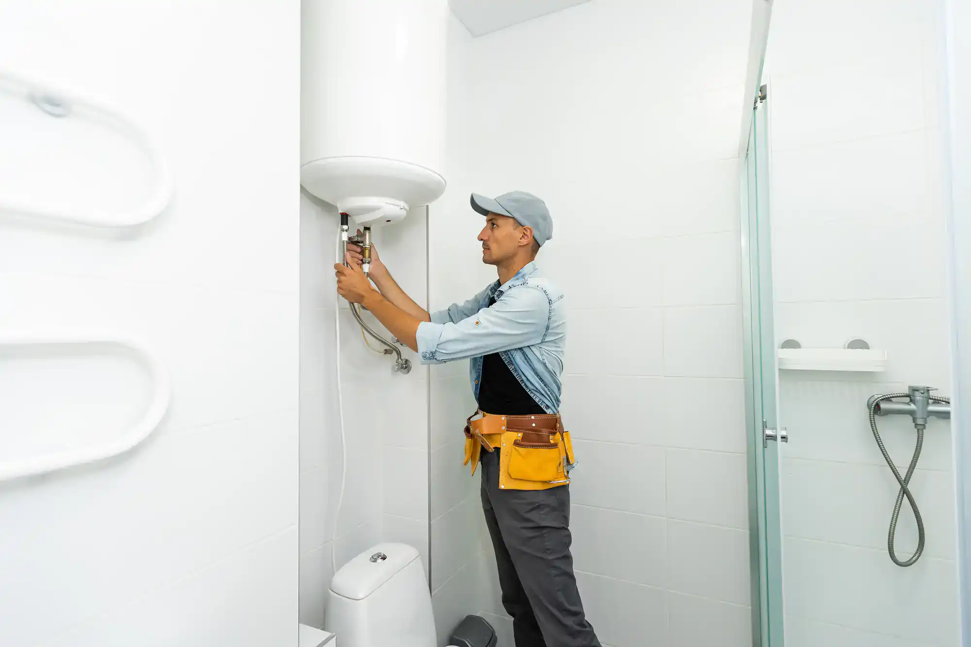 Skilled technician installing a high-efficiency water heater in a home in El Dorado County, CA, with expert care and precision
