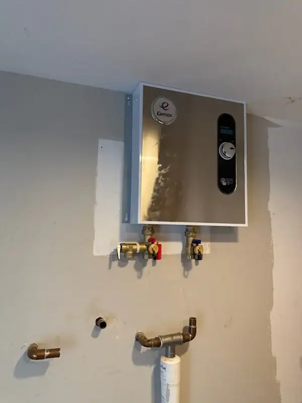 Professional plumber installing tankless water heater in El Dorado County, CA